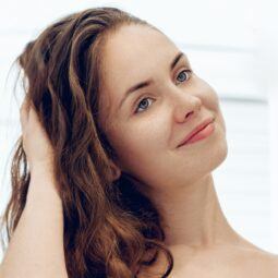woman drying her hair