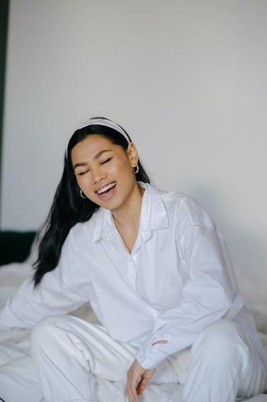 Asian woman with long hair smiling