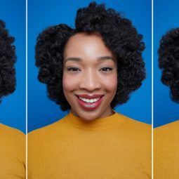 Flexi rods on natural hair girl smiling with afro hair