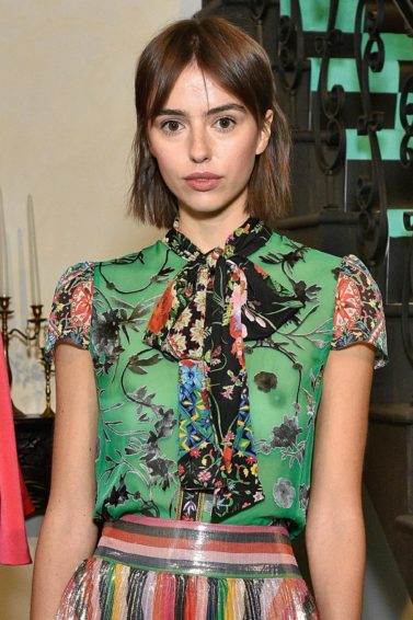 model at NYFW with brown long bob and bardot bangs